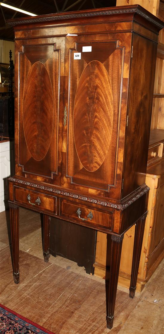 Inlaid mahogany cabinet with drawers below(-)